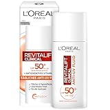 L'Oréal Paris Gesichtspflege mit LSF 50+ und antioxidativem Vitamin C, Anti-UV Fluid für alle Hauttypen, Gegen die ersten...